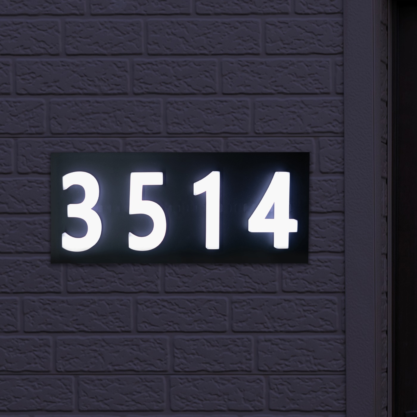 Glomensio Firefly LED backlit house number glowing warmly at night for clear street visibility