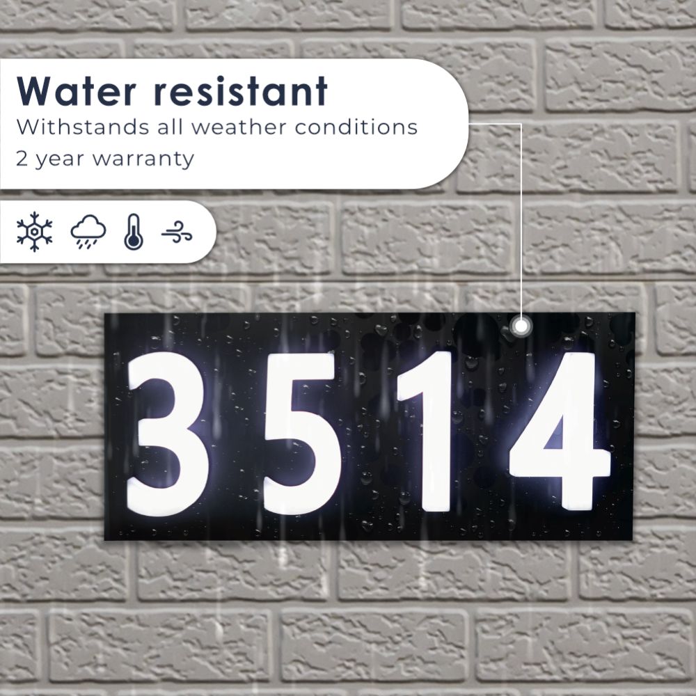 Glomensio Firefly illuminated house number in rain — water resistant, withstands all weather conditions, 2-year warranty with sun, rain, temperature, and wind resistance icons